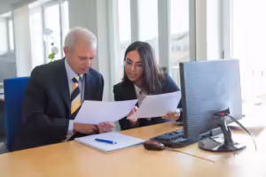 female professional explaining document details client workplace serious business leader consulting financial legal expert teamwork cooperation concept 74855 14235 1