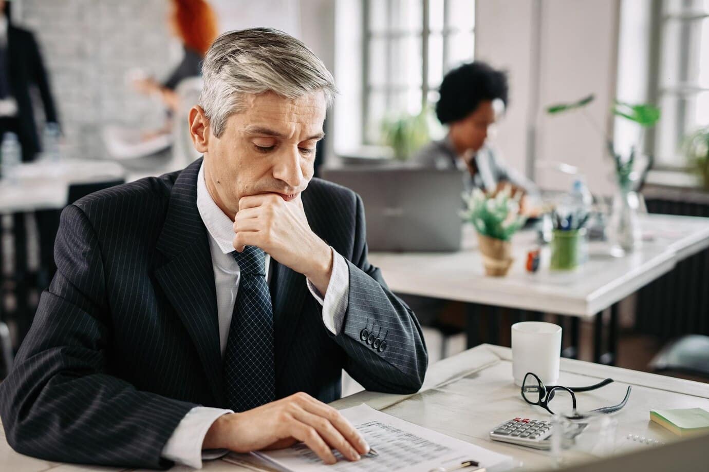 https://www.freepik.com/free-photo/thoughtful-businessman-sitting-desk-office-going-through-financial-reports_25485550.htm#fromView=search&page=1&position=40&uuid=bb8d276c-45bd-49a3-a0fb-e544bd23bc12