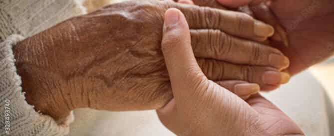 Young hands holding older hands