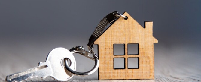 Image of a small toy house with a key