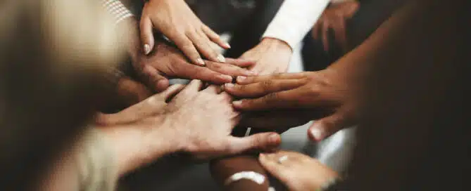 Hands together in a group