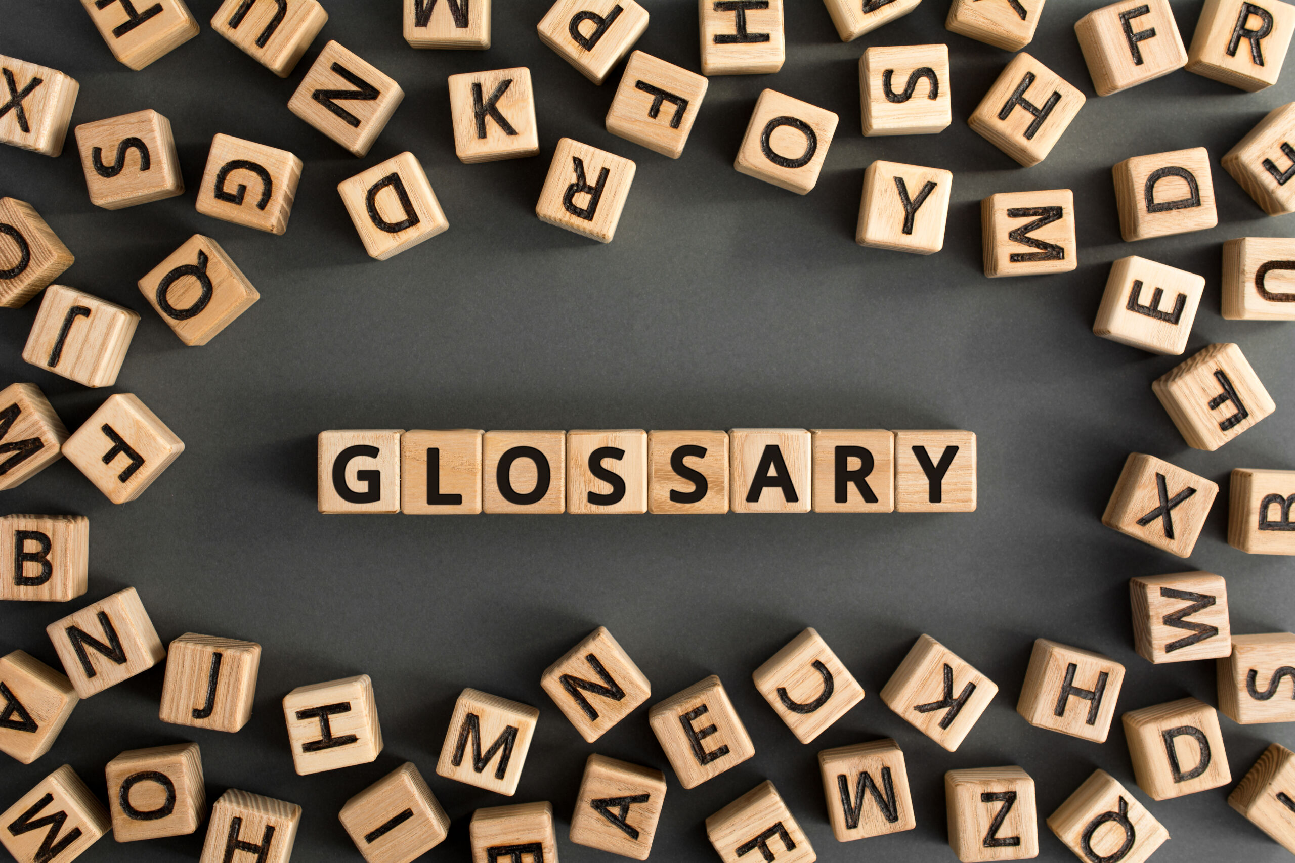 Scrabble tiles spelling the word glossary