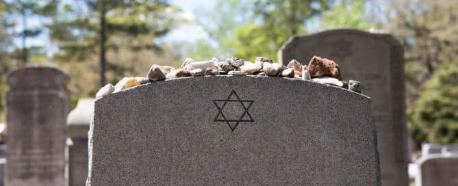 Headstone in Jewish Cemetery with Star of David and Memory Stones