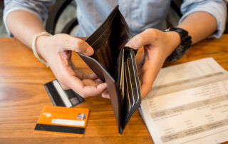 credit card debt - holding an empty wallet.