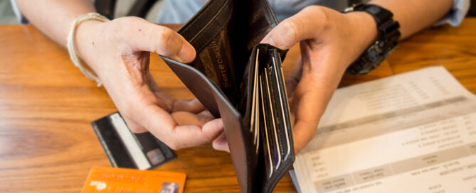 credit card debt - holding an empty wallet.