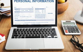 Image of someone at a computer with ID cards popping up